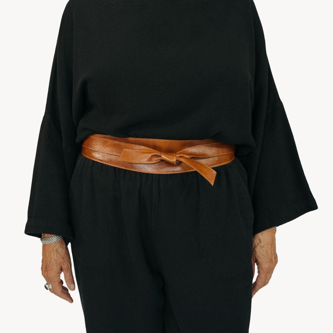 Pokoloko Obi leather wrap belt in caramel, featuring a stylish and adjustable design with a smooth finish.