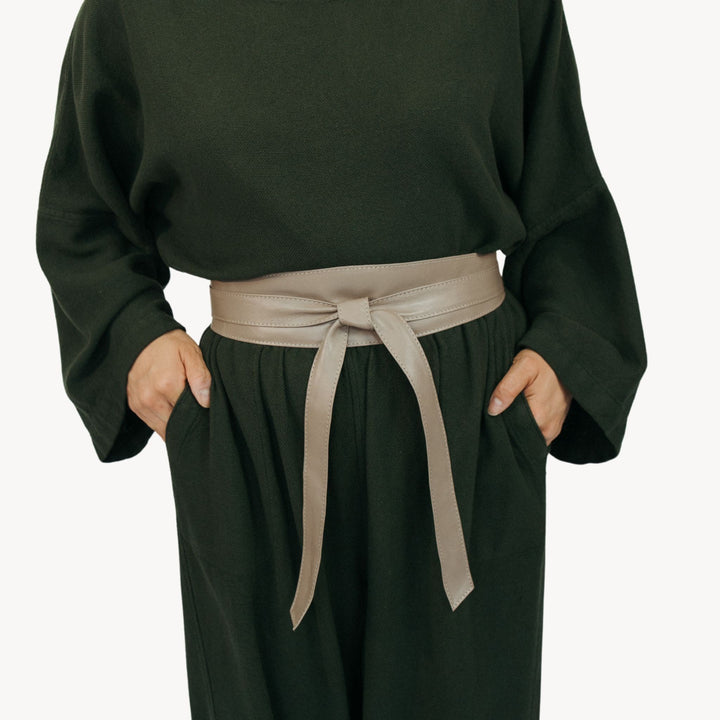 Gray leather wrap belt by Pokoloko featuring a stylish and adjustable design with a sleek, modern look.