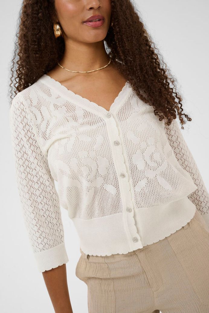 Cream Oluki patterned knit cardigan featuring white floral designs and a lightweight fit for casual wear.