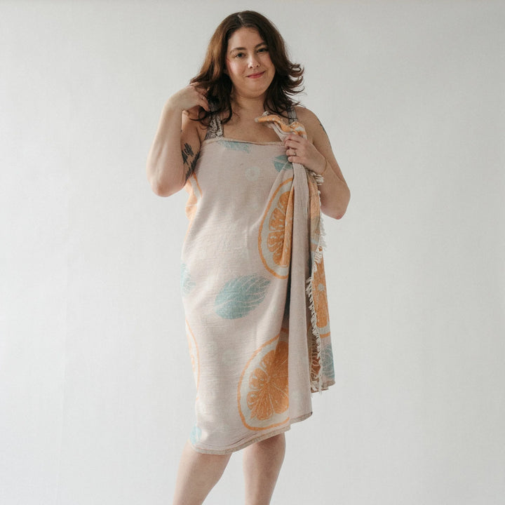 Orange Leaf Turkish Cotton Towel by Pokoloko, soft and plush with vibrant orange leaf pattern, perfect for beach or bath use.
