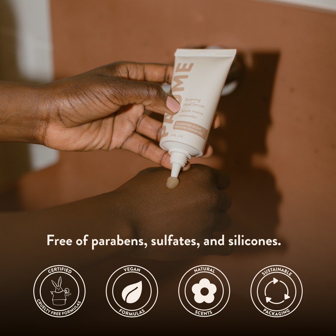 Hand applying Paume anti aging hand serum to another hand with product certification icons at the bottom.