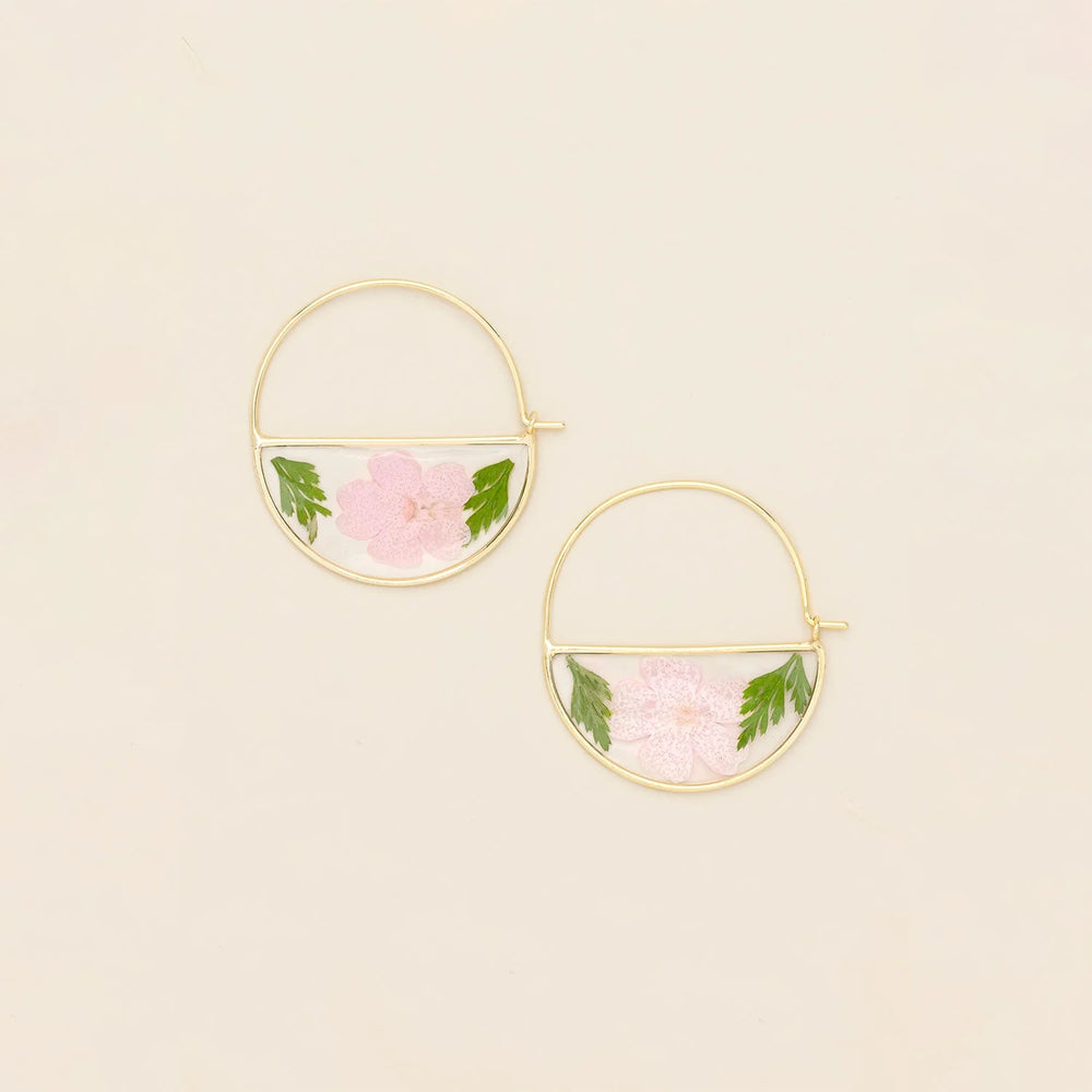 Scout pressed flower hoop earring showing delicate floral design on a silver hoop for a stylish, nature-inspired accessory.