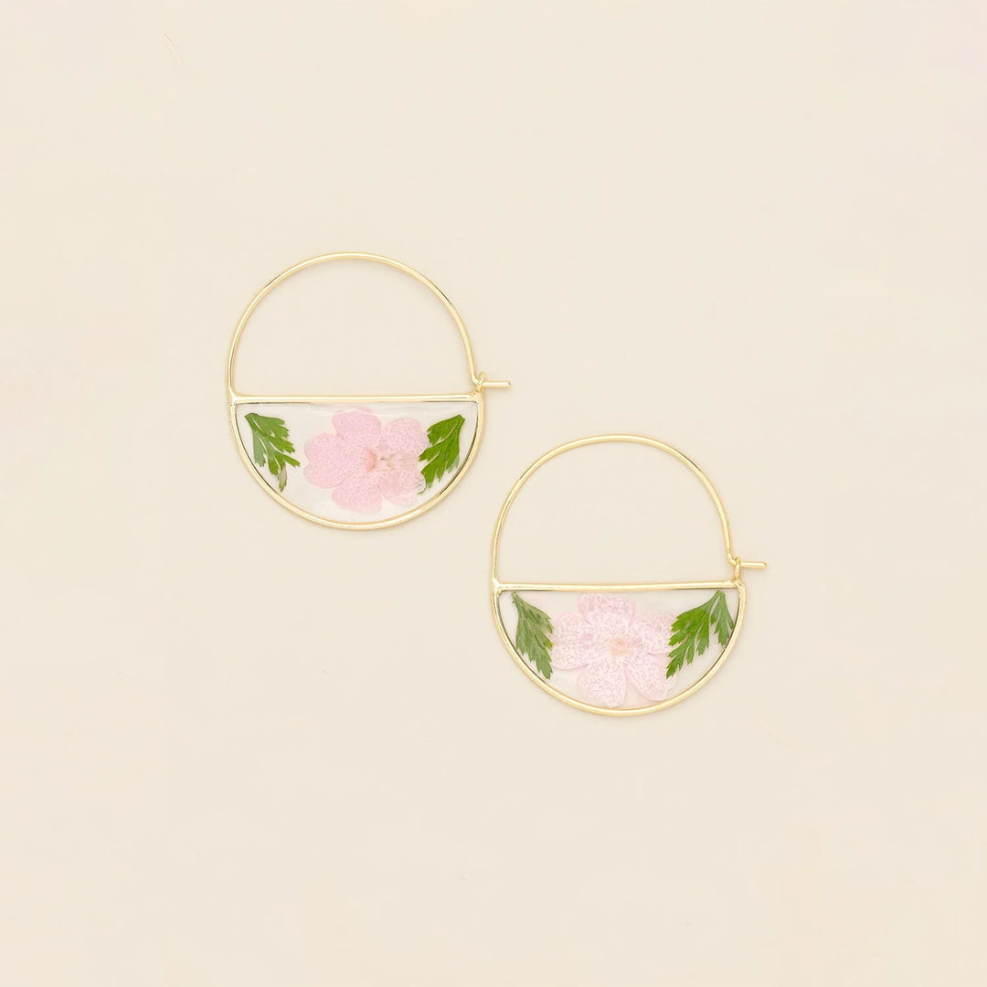 Scout pressed flower hoop earring showing delicate floral design on a silver hoop for a stylish, nature-inspired accessory.