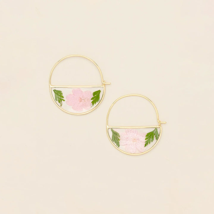 Scout pressed flower hoop earring showing delicate floral design on a silver hoop for a stylish, nature-inspired accessory.