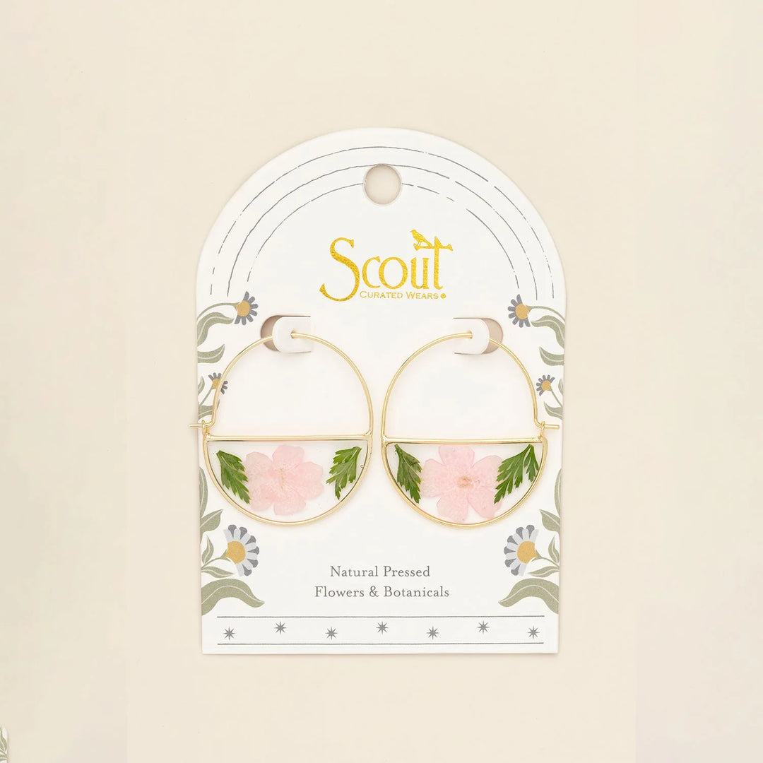 Scout pressed flower hoop earring featuring delicate pressed flowers set in a gold hoop for a natural, bohemian style.