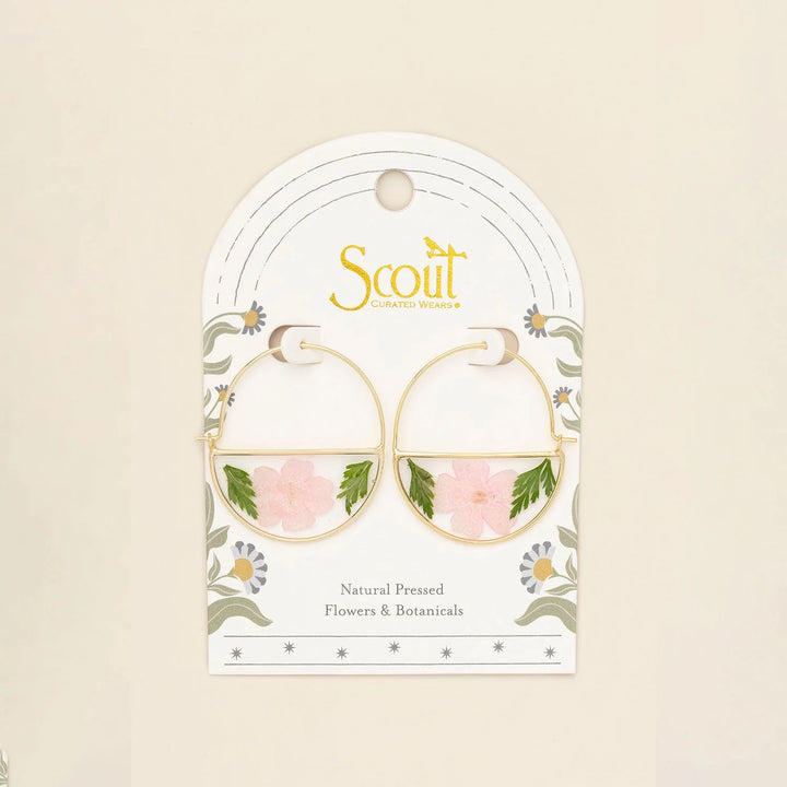 Scout pressed flower hoop earring featuring delicate pressed flowers set in a gold hoop for a natural, bohemian style.