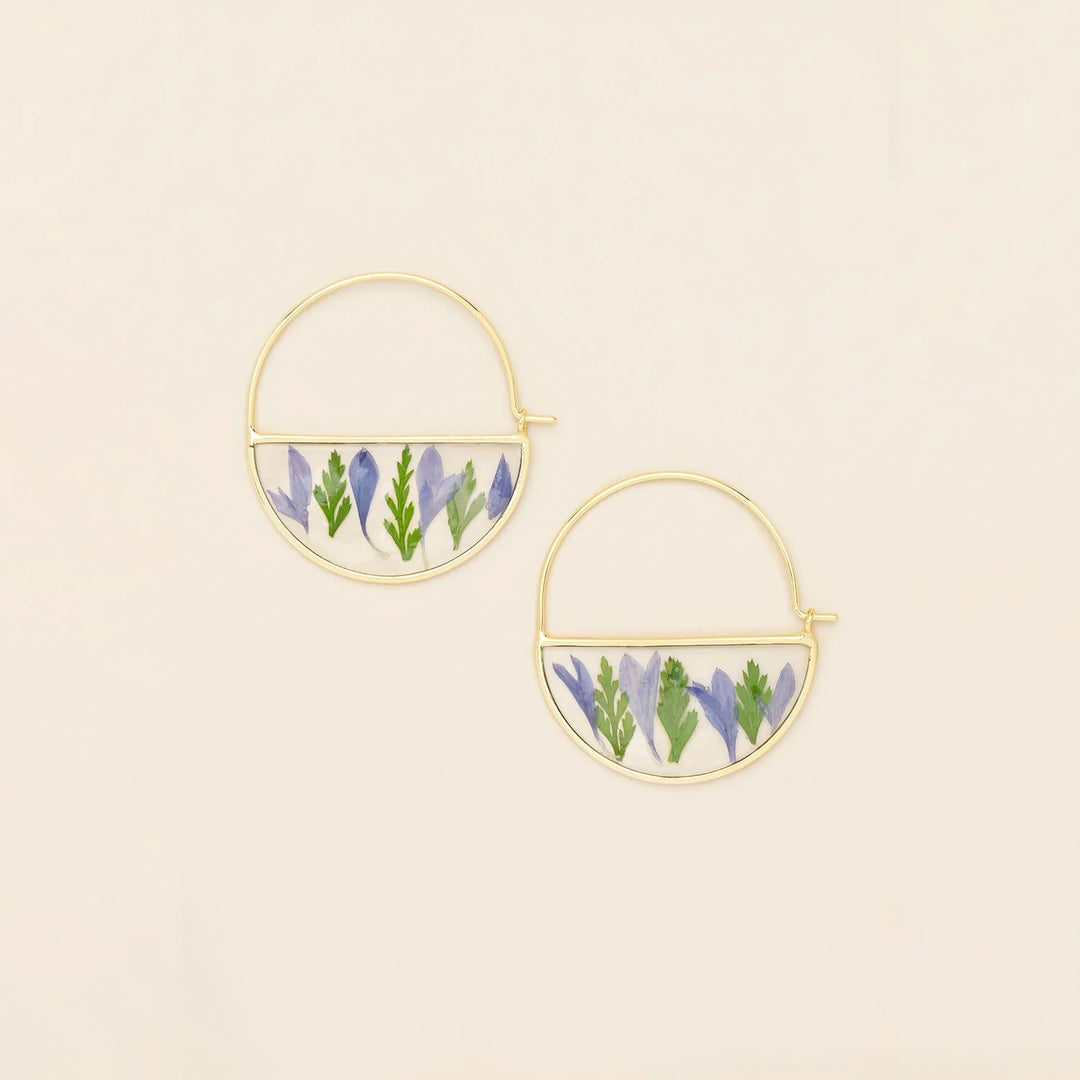 Scout pressed flower hoop earring featuring a delicate floral design on a circular metal hoop.