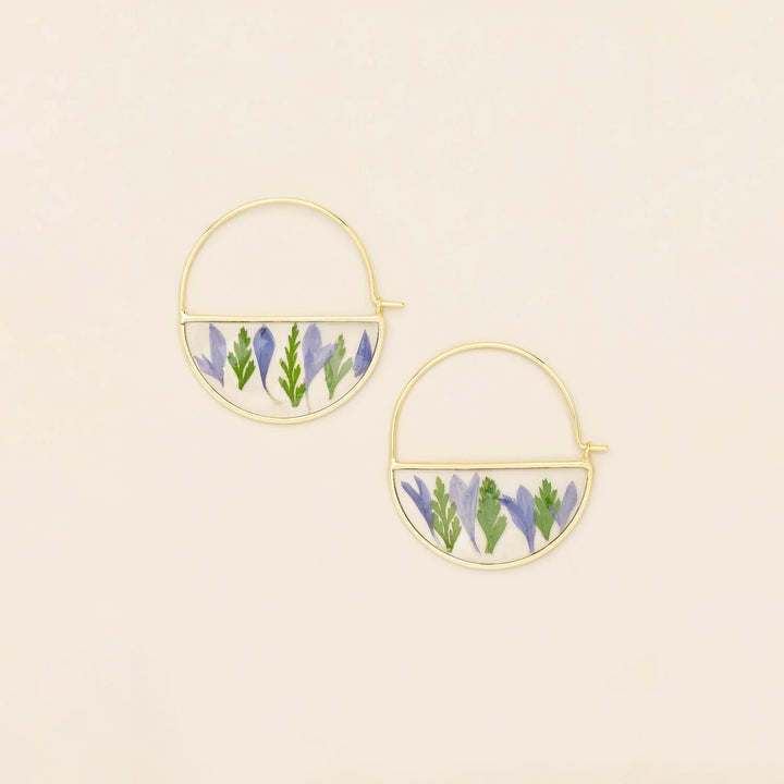 Scout pressed flower hoop earring featuring a delicate floral design on a circular metal hoop.
