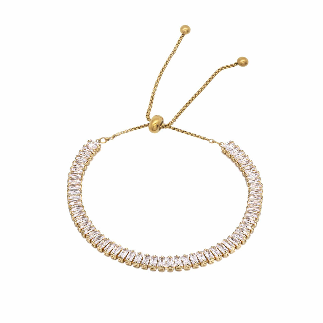 Gold bracelet with clear stones on a white background