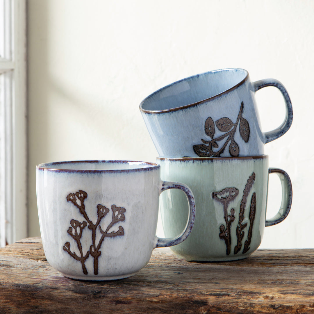 Revive Hand Etched Stoneware Collection by Danica, featuring beautifully crafted stoneware plates and bowls with intricate etching details.