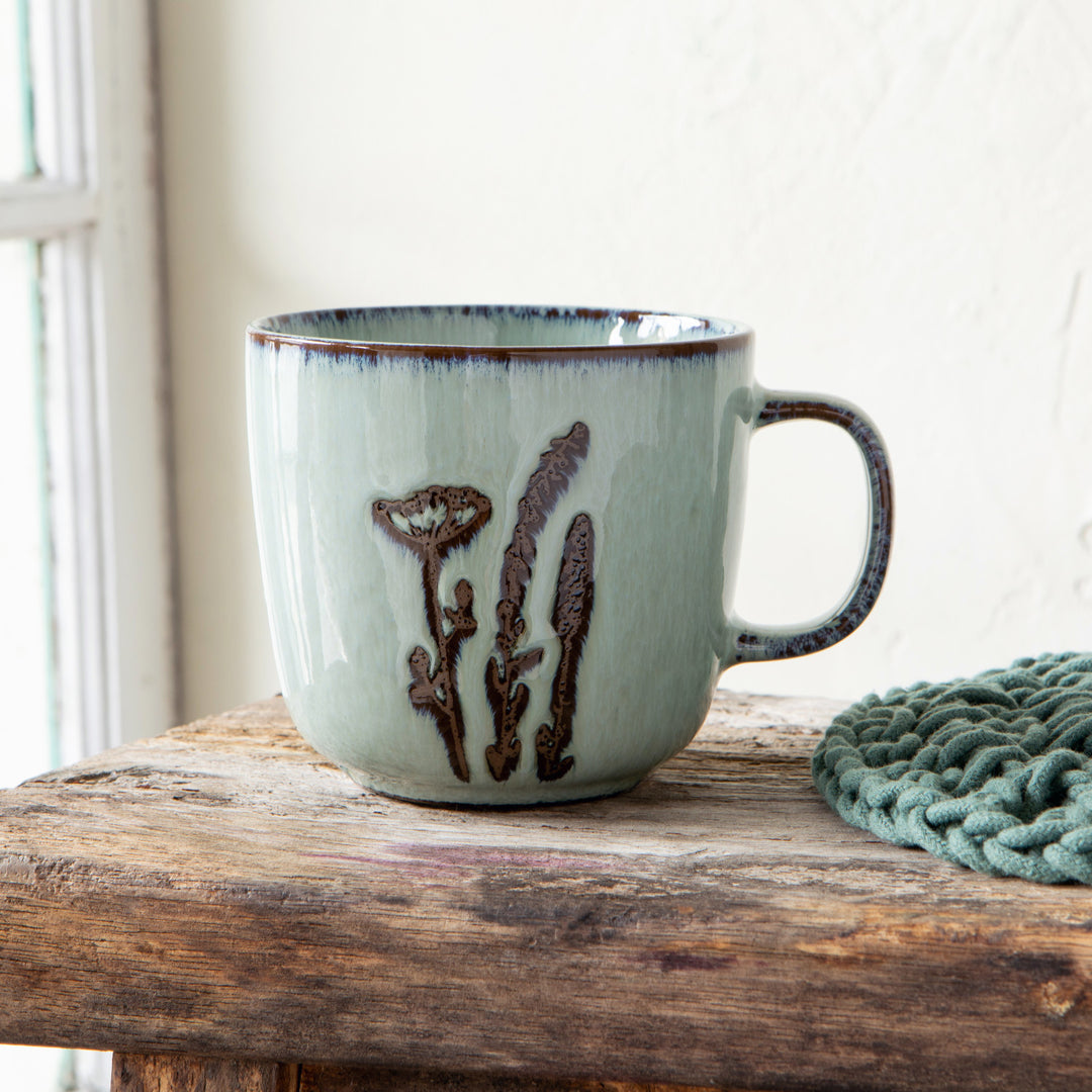 Hand-etched stoneware plate from Danica's Revive collection with intricate patterns and a textured, glazed finish.