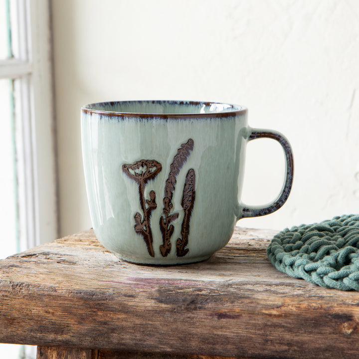 Hand-etched stoneware plate from Danica's Revive collection with intricate patterns and a textured, glazed finish.