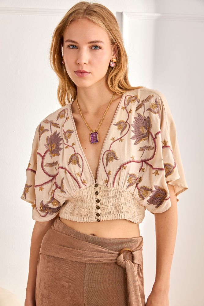 NKN by Nekane Riva embroidered blouse with intricate floral embroidery and lightweight fabric, stylish top for casual or dressy occasions.