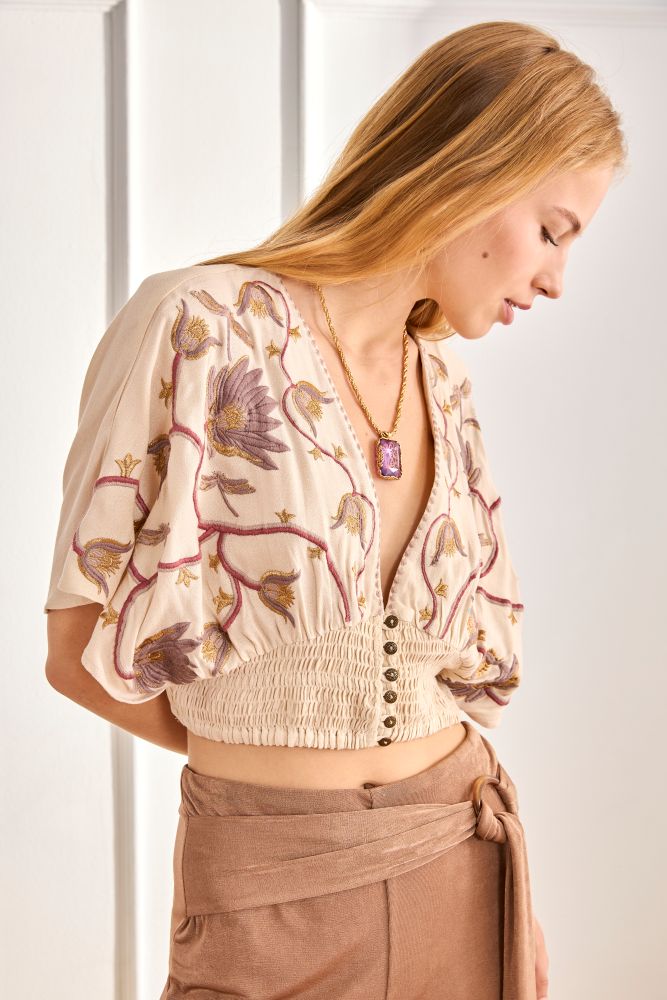 NKN by Nekane Riva embroidered blouse with intricate embroidery, lightweight fabric, and stylish design for a chic look.