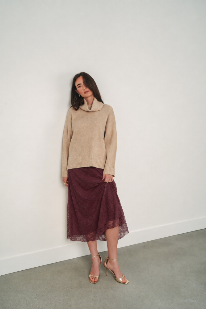 Heathered beige Gentle Fawn Runa Sweater, soft knit fabric with a relaxed fit, shown on a model.