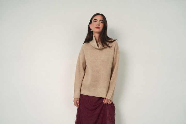 Heathered beige Gentle Fawn Runa Sweater displayed on a model, showcasing its cozy knit and relaxed fit.