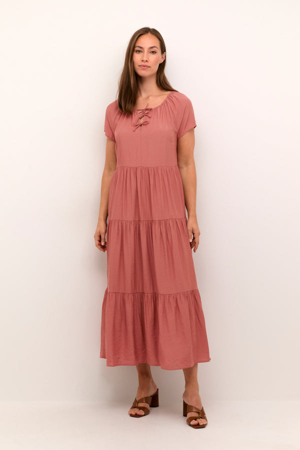 Cotton-viscose blend maxi dress with flowy tiered skirt and tie detail at neckline. 