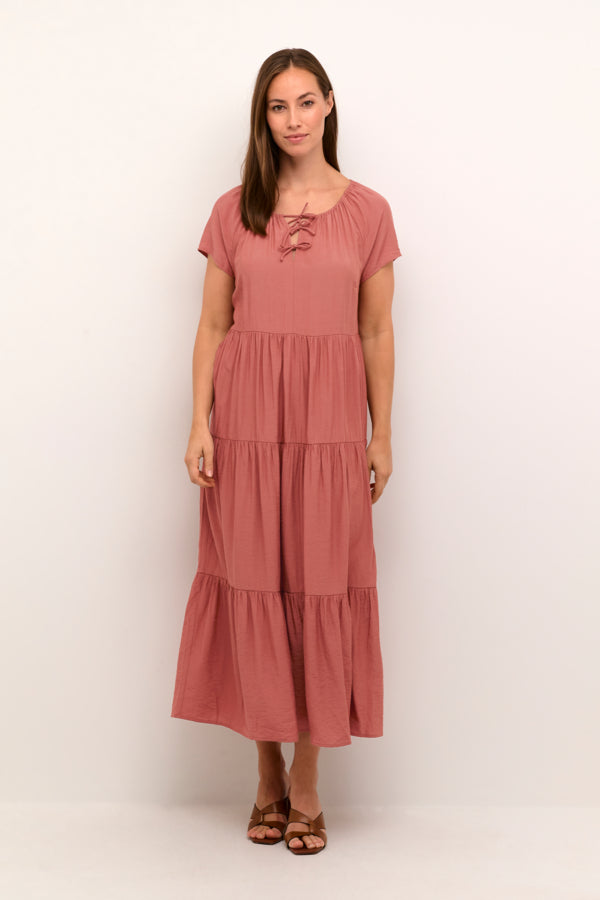 Cotton-viscose blend maxi dress with flowy tiered skirt and tie detail at neckline. 