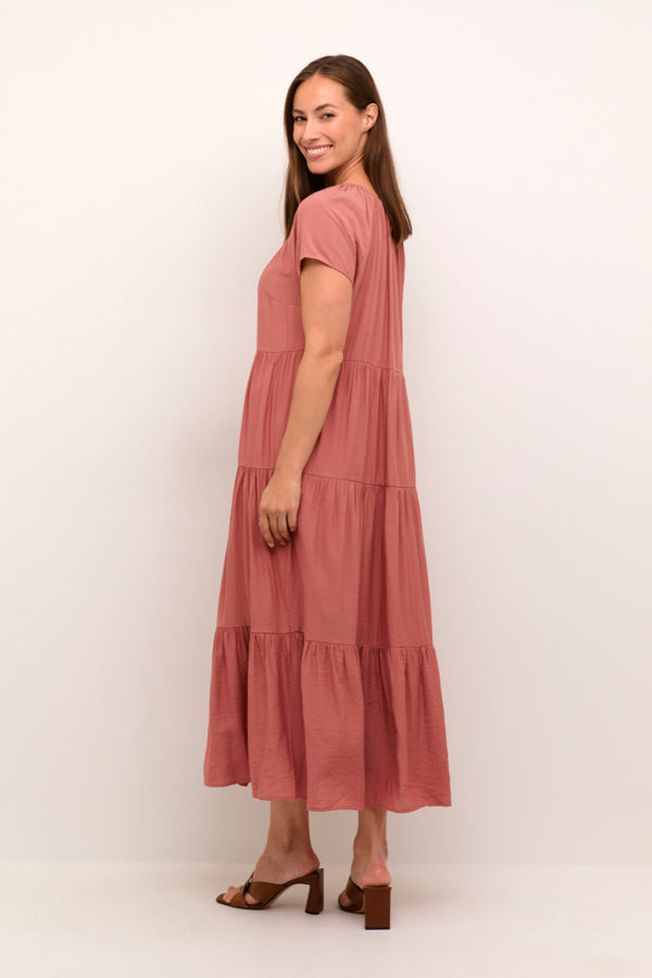 Cotton-viscose blend maxi dress with flowy tiered skirt and tie detail at neckline. 