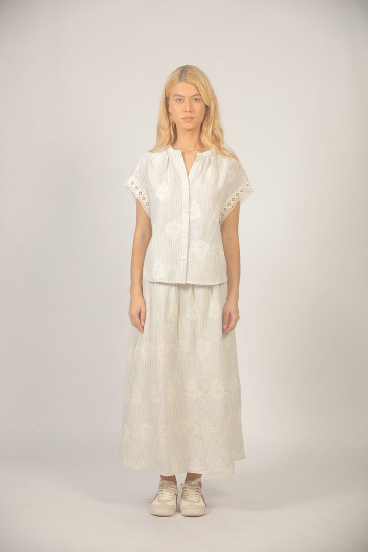 See You Soon Freya embroidered maxi skirt featuring intricate floral embroidery and a flowing fabric design.