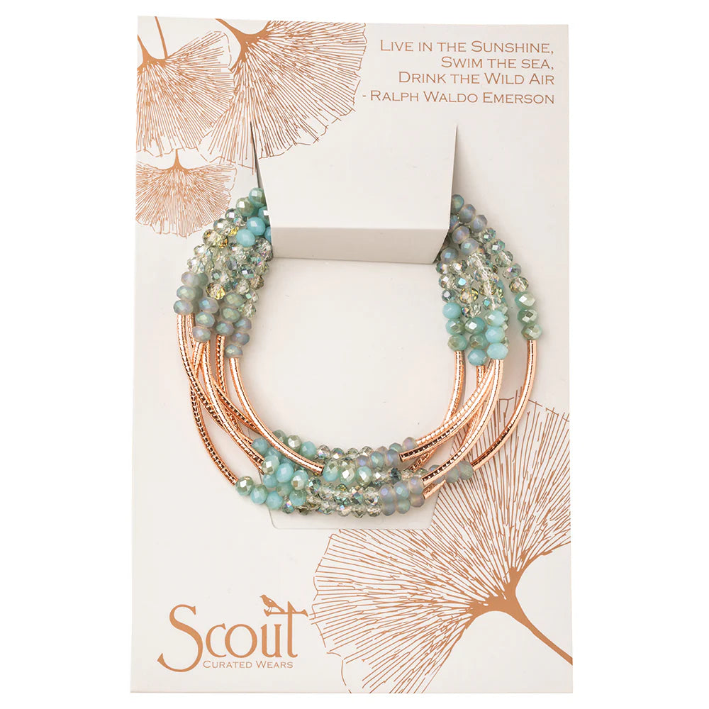 Scout Curated Wears Scout Wrap bracelet in Neptune Rose Gold, featuring a stylish, woven design with metallic accents.