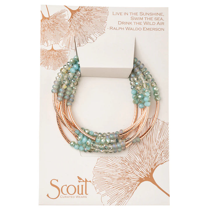 Scout Curated Wears Scout Wrap bracelet in Neptune Rose Gold, featuring a stylish, woven design with metallic accents.