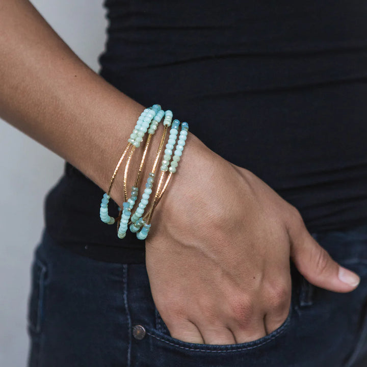 Scout Curated Wears Neptune Rose Gold Wrap Bracelet featuring a stylish, adjustable design with elegant bead accents.