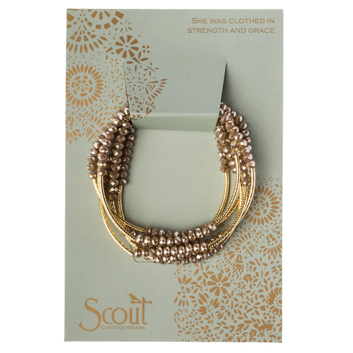 Gold Scout Curated Wears wrap bracelet with oyster accents, stylish accessory for everyday wear.