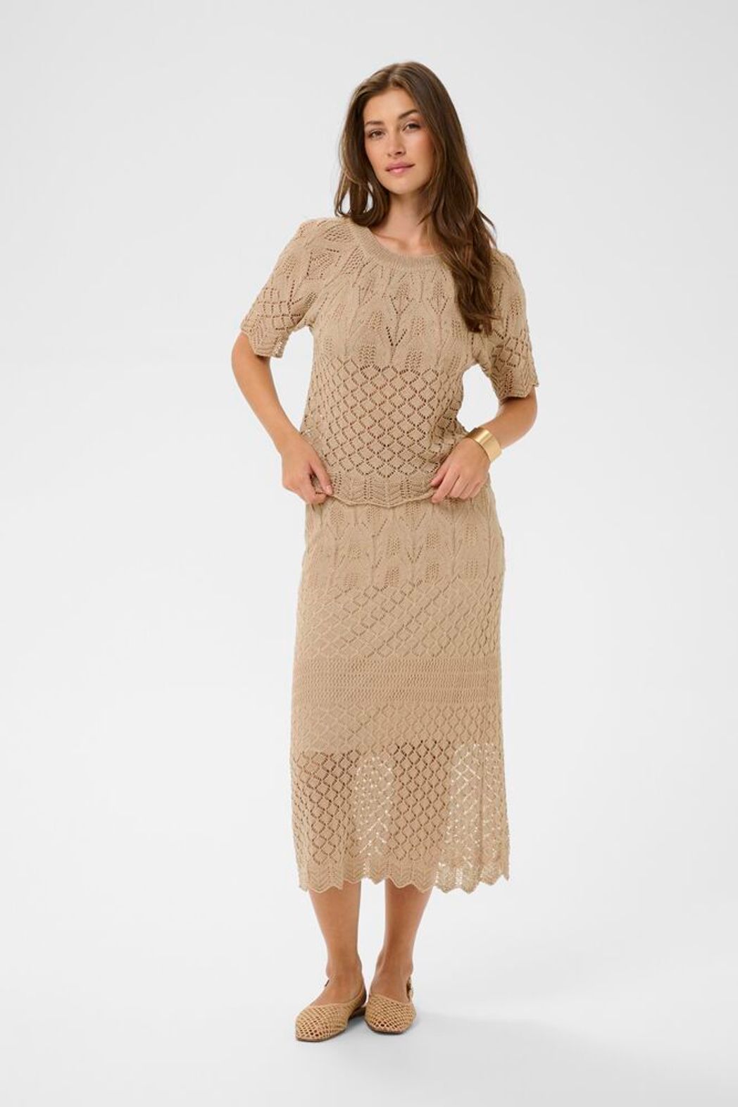 Cream Sevija knit short sleeve top featuring a snug fit, soft fabric, and stylish design ideal for casual or office wear for summer .