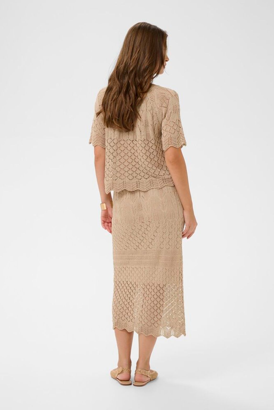 Cream Sevija knit short sleeve top featuring a soft, textured fabric and a stylish, fitted design for summer .