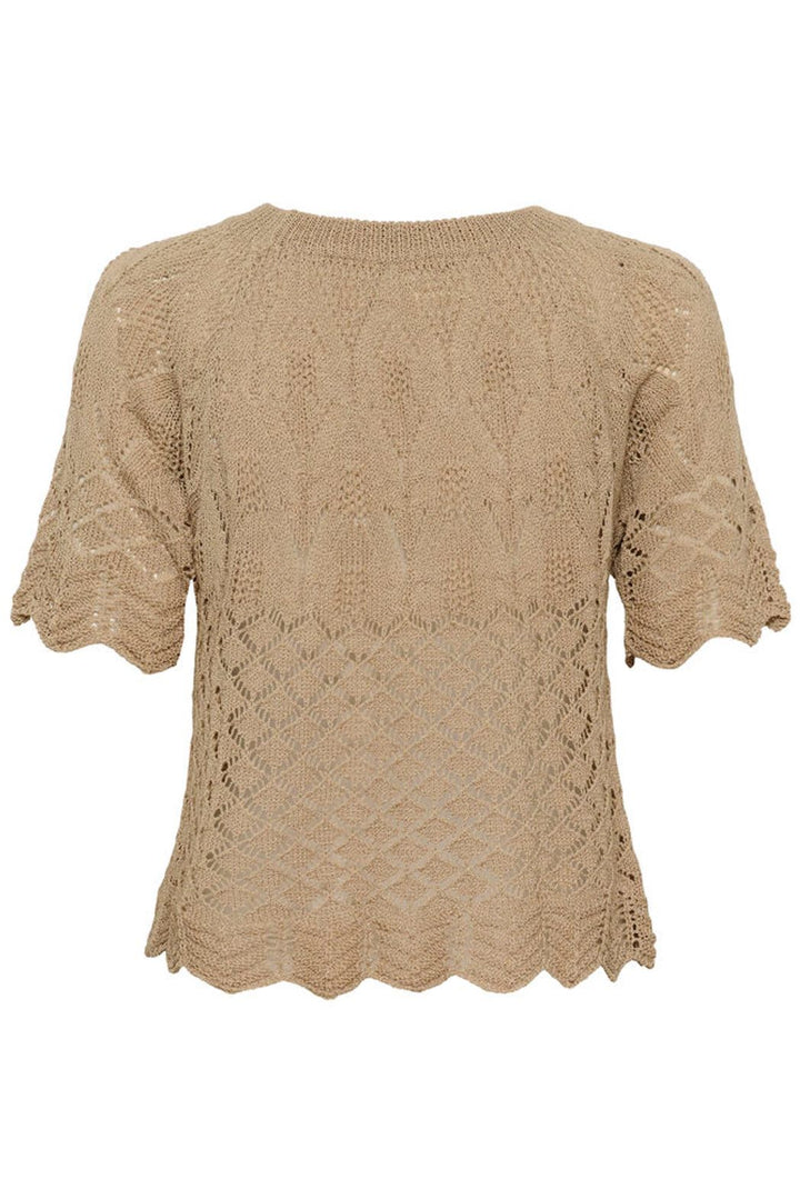 Cream Sevija knit short sleeve top featuring a soft yarn fabric and classic fit, shown on a model with a casual, stylish summer vacation look.