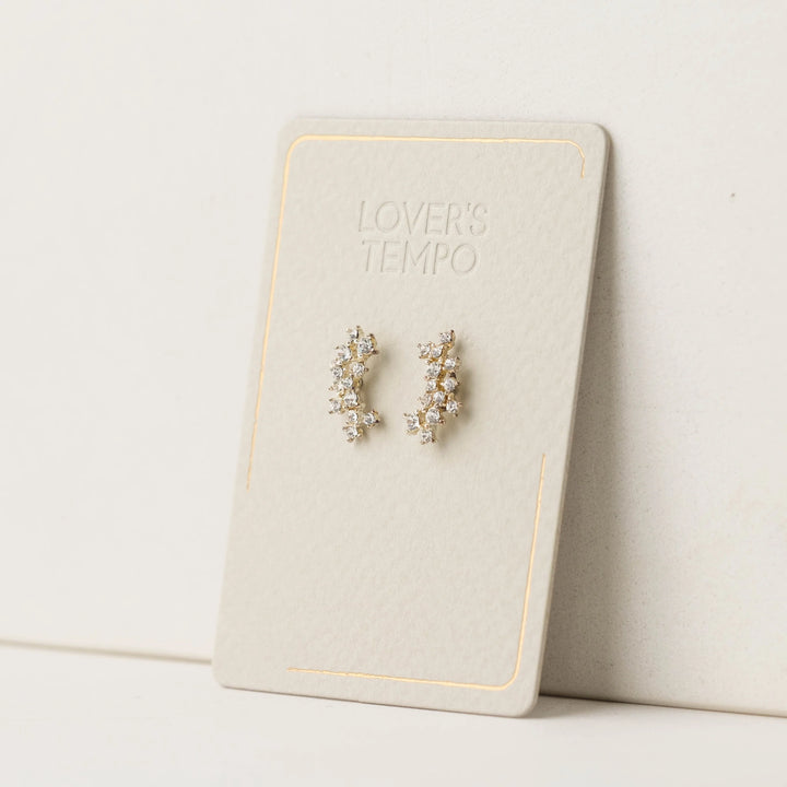 Pair of crystal climber earrings on a 'Lover's Tempo' branded card against a light background