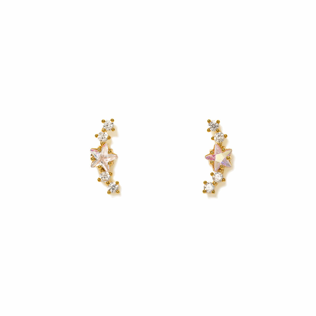 Pair of gold and crystal earrings on a white background