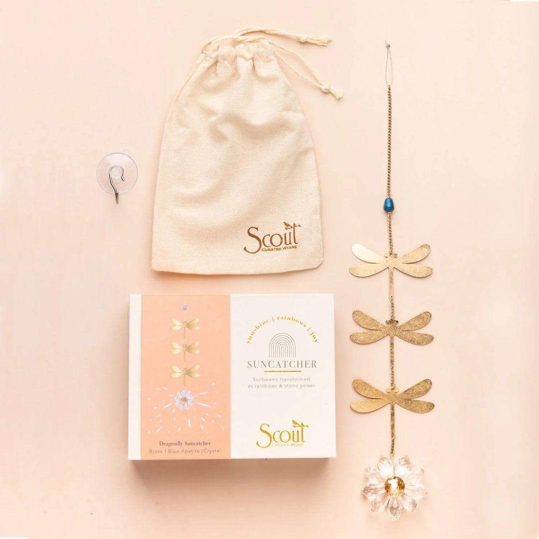 Blue Apatite dragonfly suncatcher by Scout featuring a detailed gold dragonfly with  blue stone accent and crystal hanging from a delicate chain.