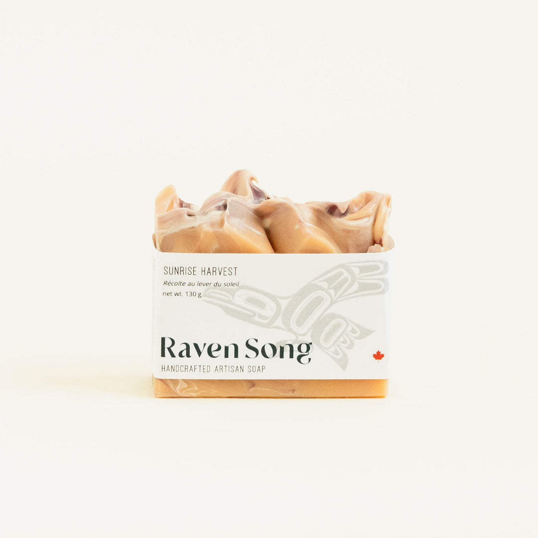 RavenSong Soap & Candle Sunrise Harvest artisan hand soap with citrus and patchouli scent, featuring a natural soap bar with vibrant colors.
