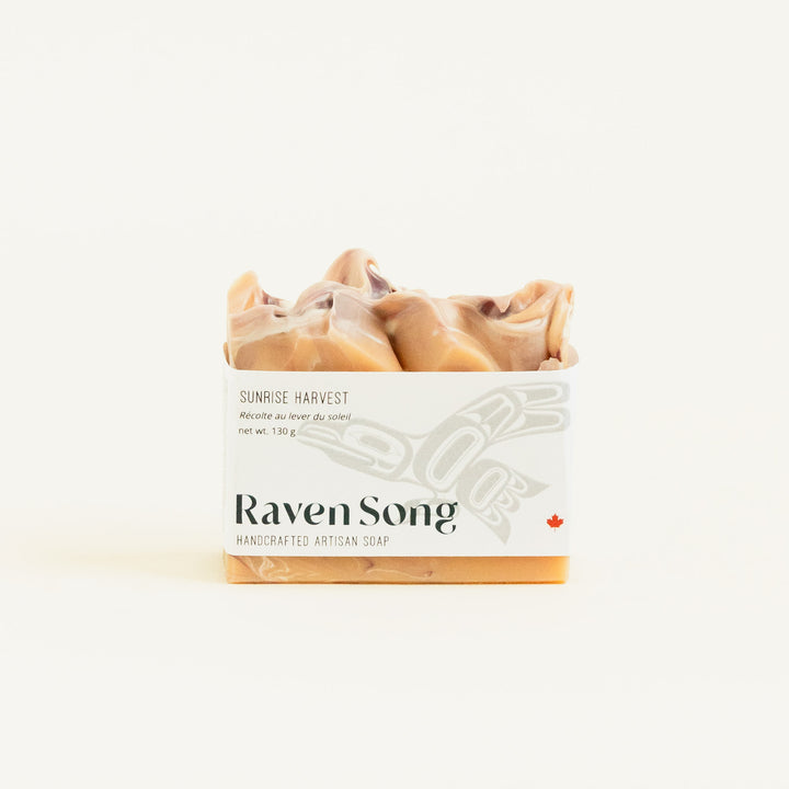 RavenSong Soap & Candle Sunrise Harvest artisan hand soap with citrus and patchouli scent, featuring a natural soap bar with vibrant colors.