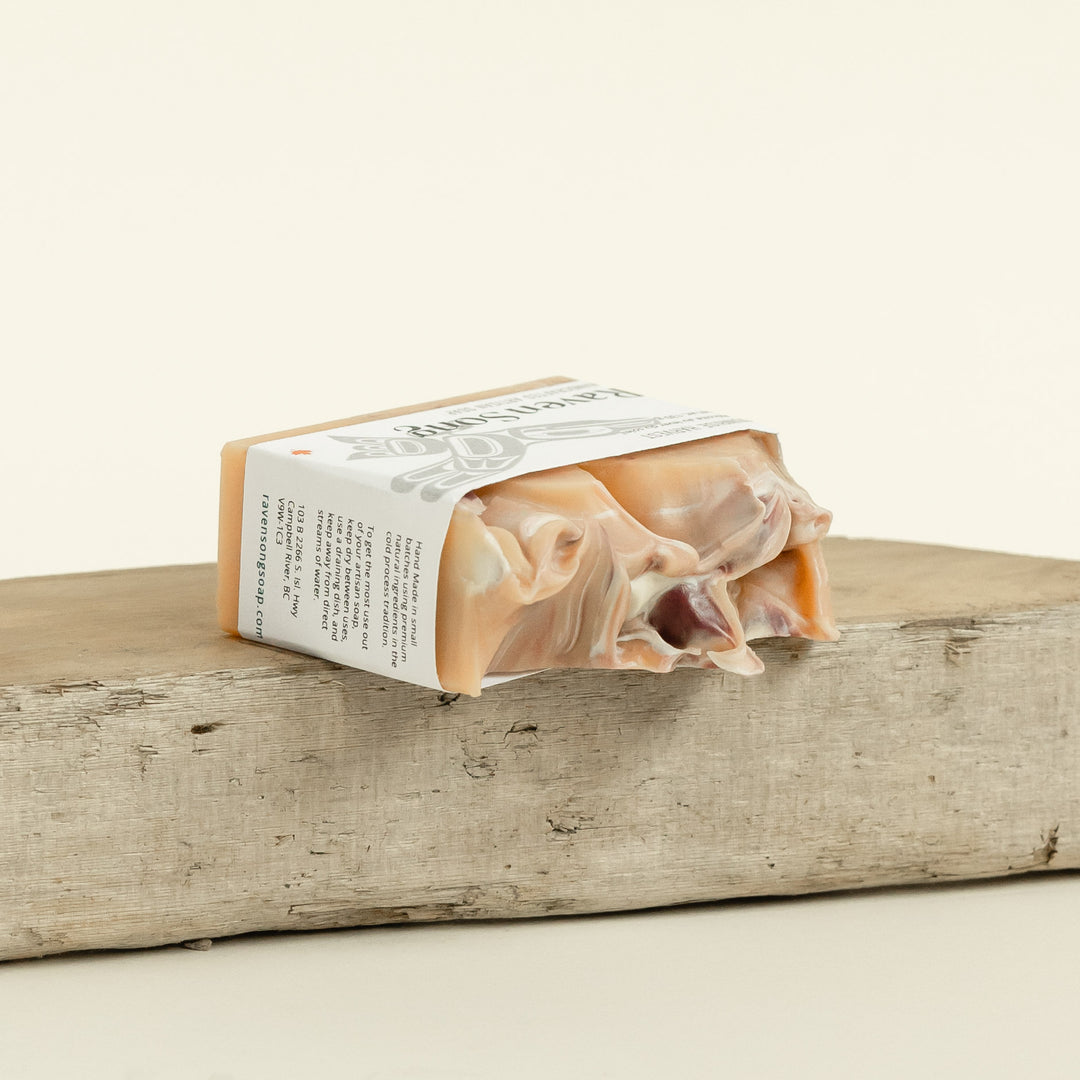 RavenSong Soap & Candle Sunrise Harvest Artisan hand soap with citrus and patchouli scent, featuring a rustic soap bar with natural ingredients.