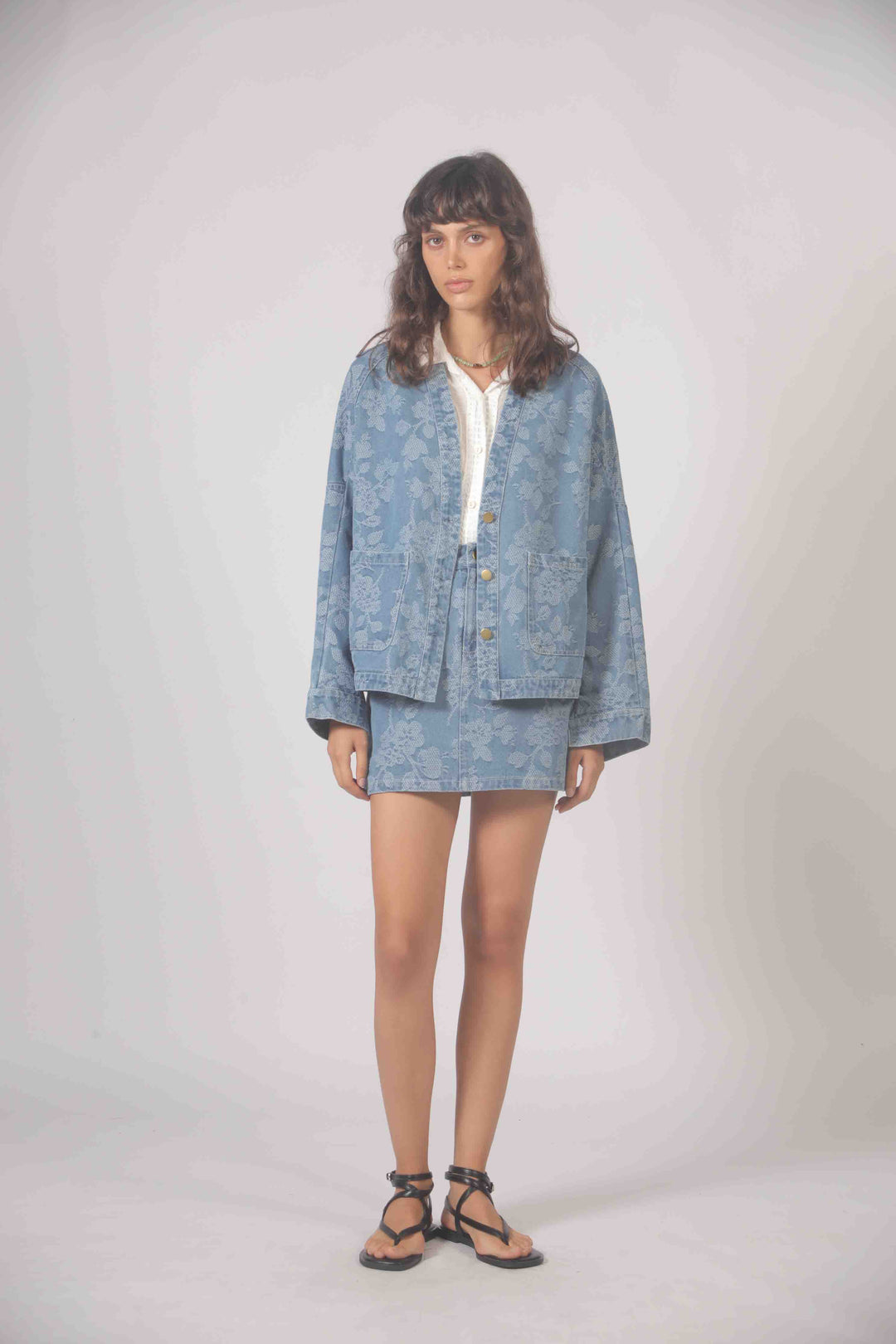 Freeflower embroidered denim jacket by The Korner featuring detailed floral embroidery on classic blue denim.