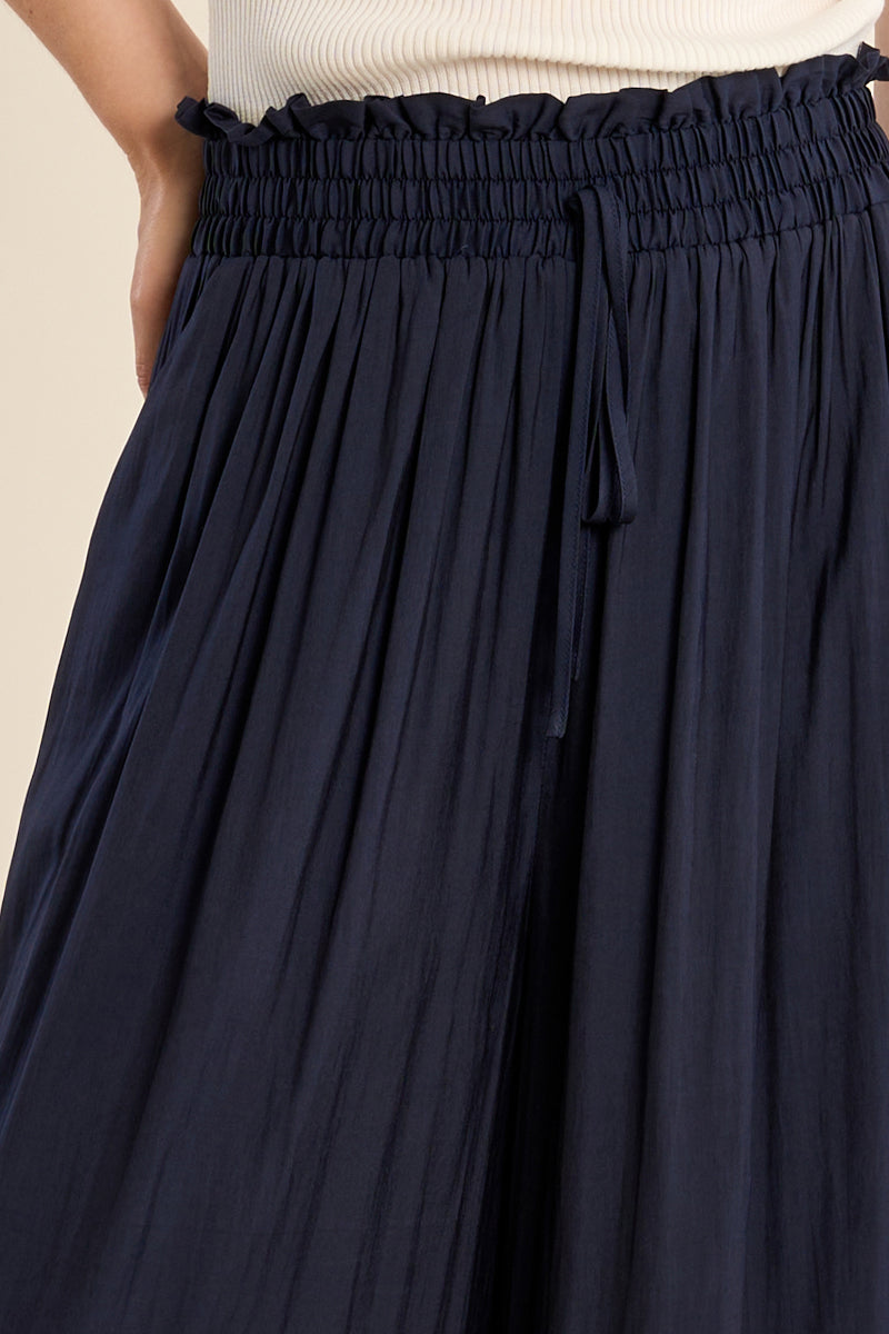 Navy palazzo pant from Molly Bracken featuring a flowy, wide-leg design and smooth drape fabric for a stylish, comfortable look.