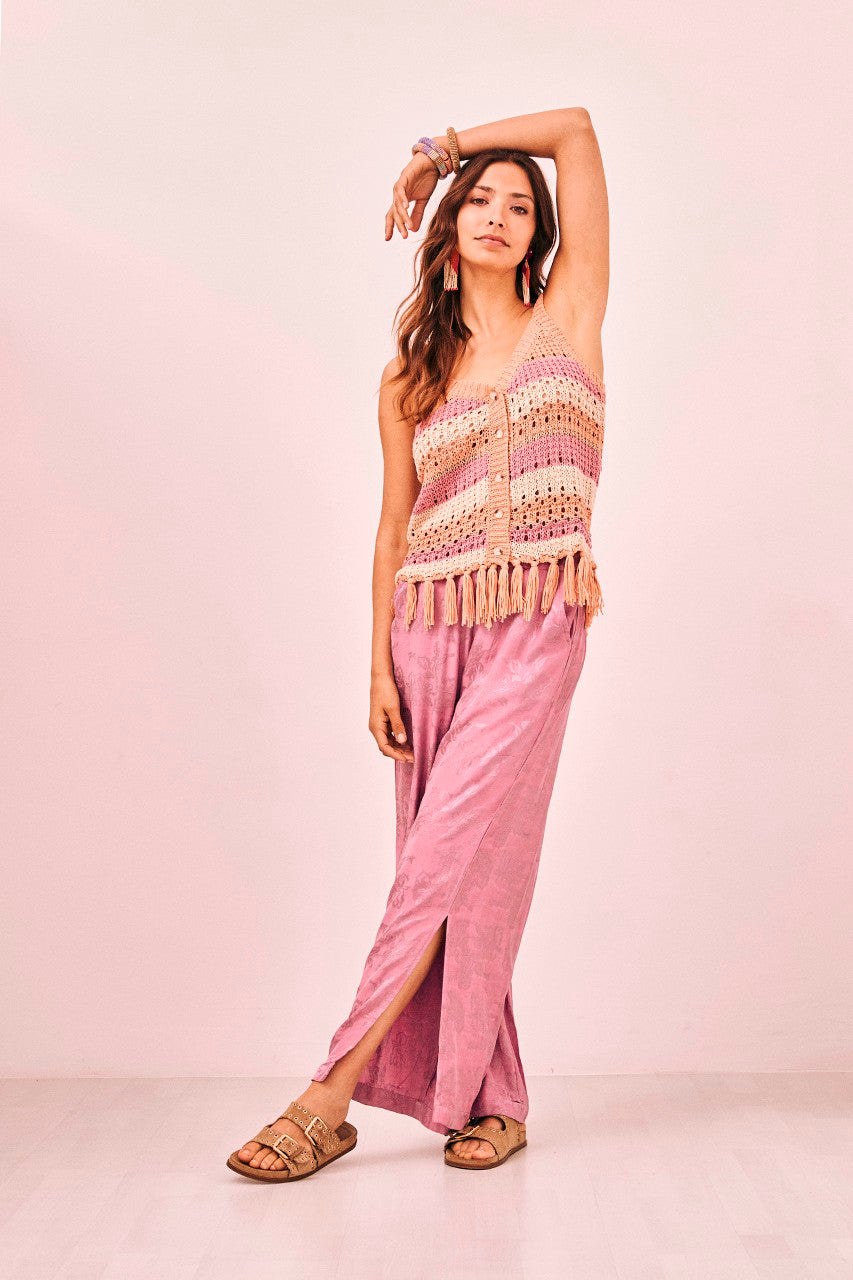 Women’s bohemian style knit tank top with peach, pink and cream stripes and button front with tassel details 