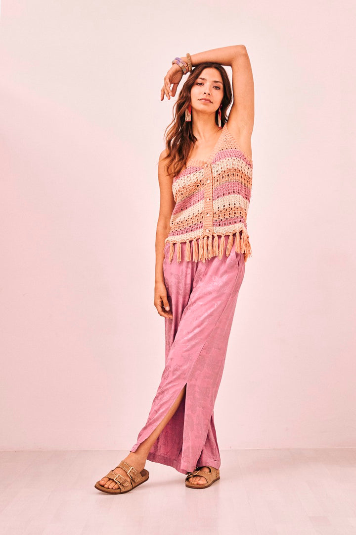 Women’s bohemian style knit tank top with peach, pink and cream stripes and button front with tassel details 
