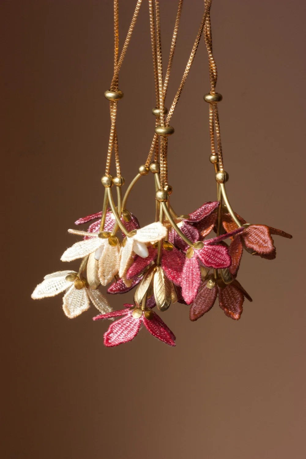 Tahitian Gardenia flower necklace by Ilk Jewelry featuring a delicate floral design in vintage lace .