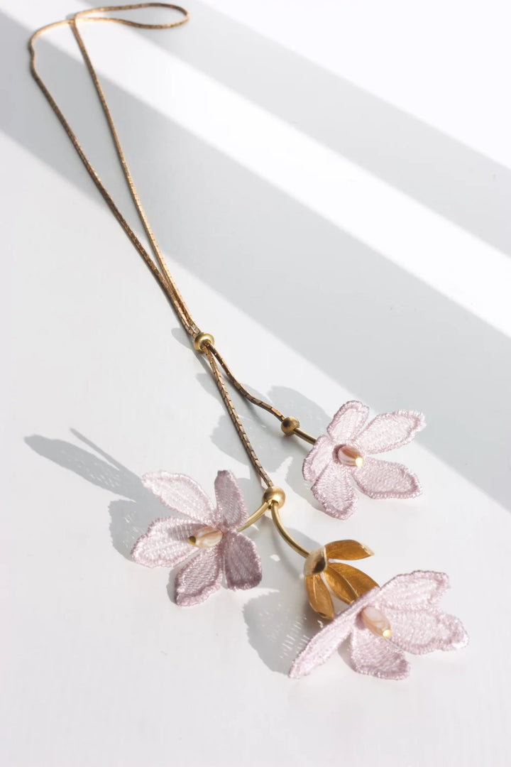 Tahitian Gardenia flower necklace by Ilk Jewelry featuring a delicate floral pendant  in vintage lace on a fine gold chain.