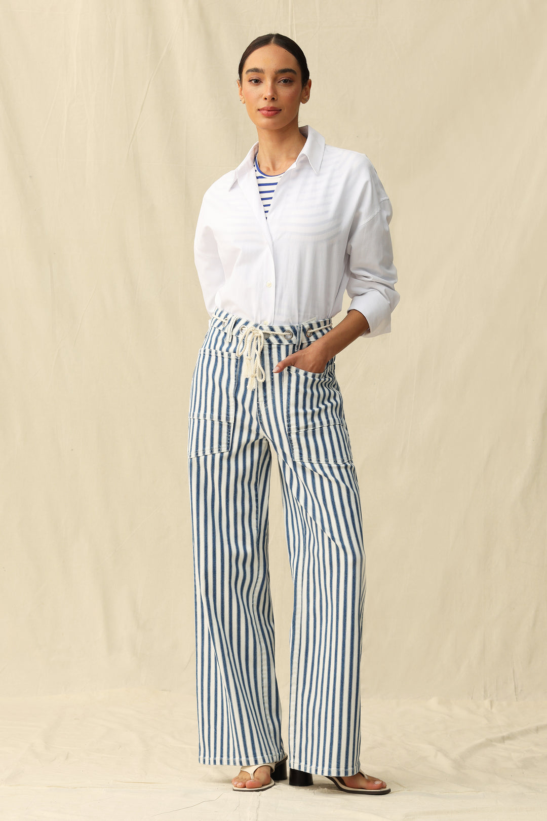 Woman wearing Tamsin Rail Stripe Wide Leg Jeans by Bayeas, showing the stylish striped pattern and relaxed fit on a neutral background.
