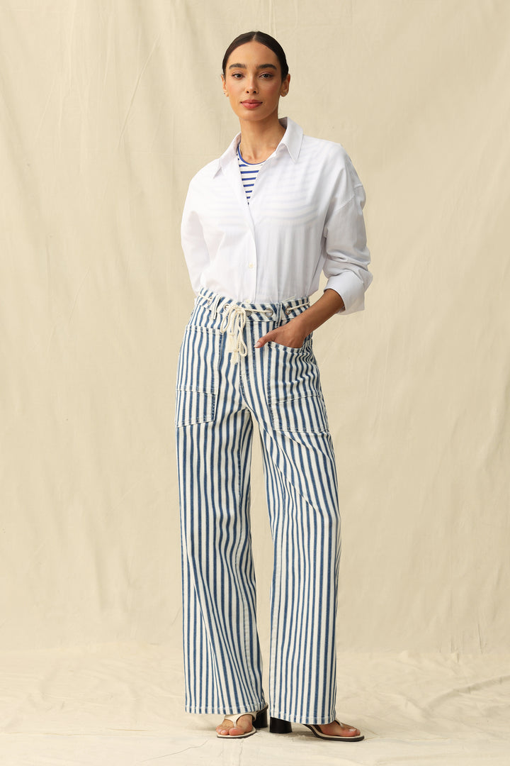 Woman wearing Tamsin Rail Stripe Wide Leg Jeans by Bayeas, showing the stylish striped pattern and relaxed fit on a neutral background.