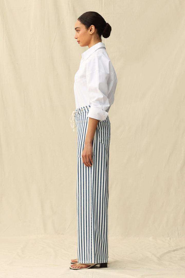 Woman in Tamsin Rail Stripe Wide Leg Jeans by Bayeas, showcasing relaxed fit and stylish rail stripe design against a neutral background.