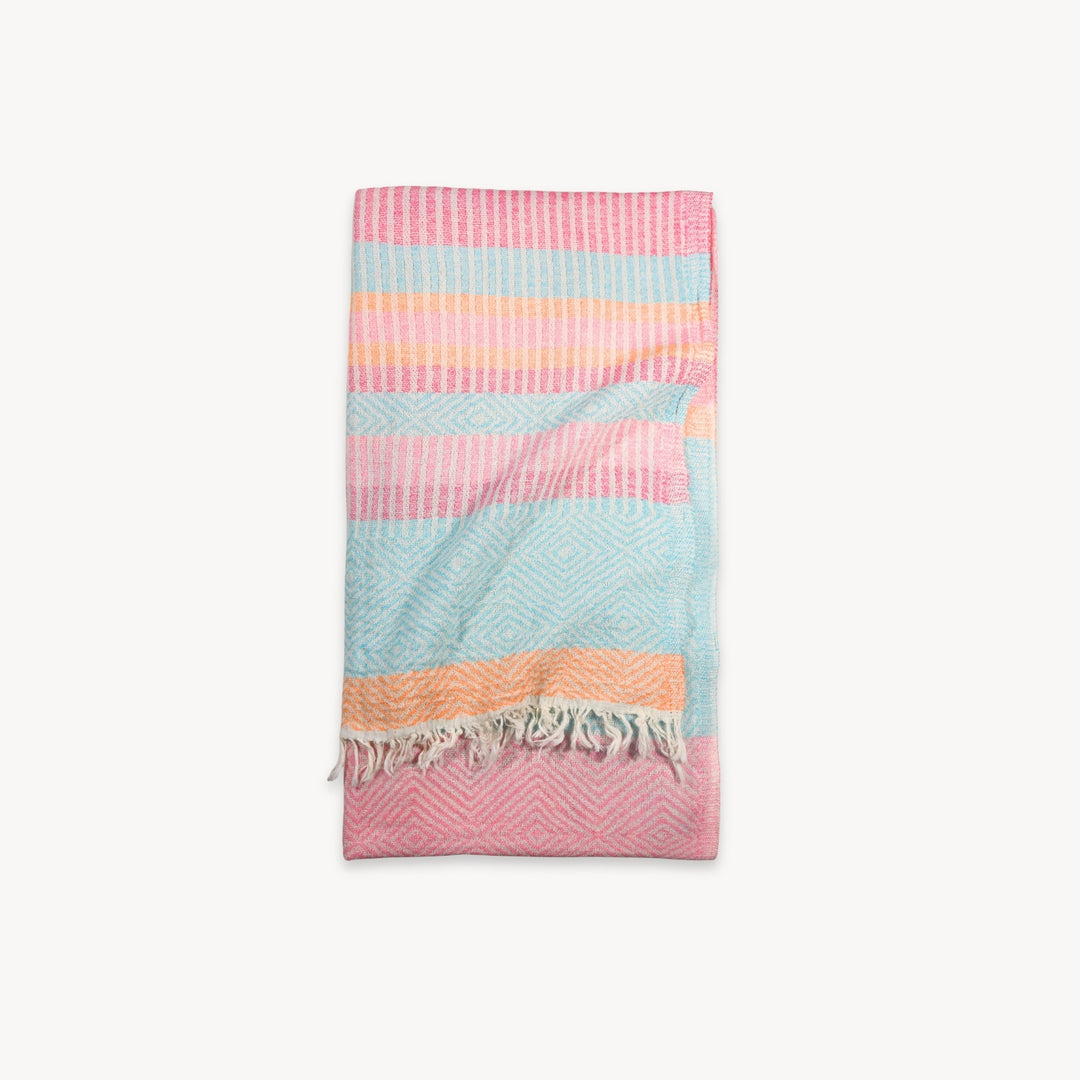 Pokoloko Teaberry Stripe Turkish Cotton Towel with vibrant red and white stripes, soft and absorbent for beach or bath use.