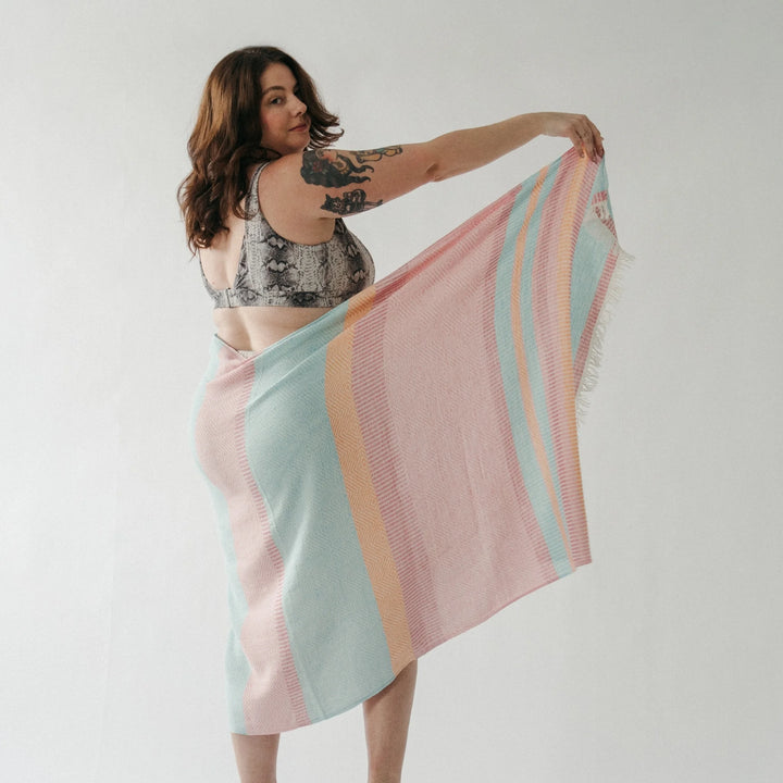 Turkish cotton towel with Teaberry Stripe pattern from Pokoloko, featuring soft, absorbent fabric and vibrant stripe design.