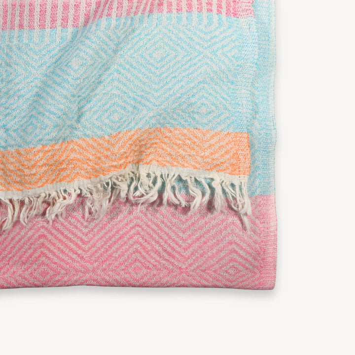 Pokoloko Teaberry Stripe Turkish Cotton Towel with vibrant red and white striped pattern, soft and absorbent for beach or bath use