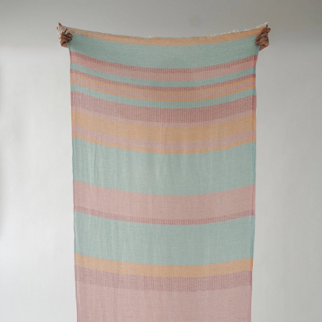 Turkish cotton towel with Teaberry stripe design by Pokoloko, showcasing soft, absorbent fabric and vibrant striped pattern.